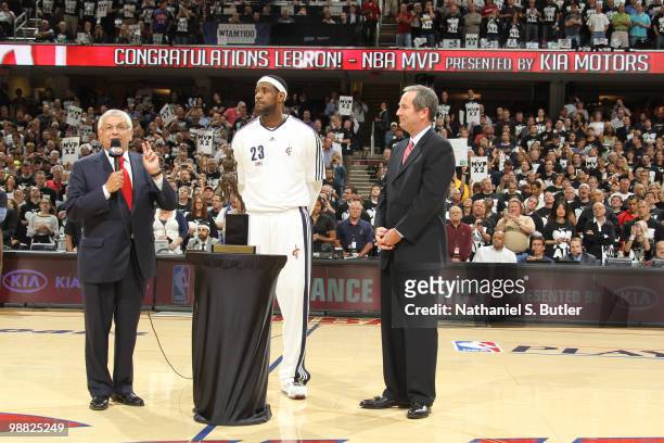 LeBron James of the Cleveland Cavaliers receives the Maurice Podoloff Trophy in recognition for being named the 2009-10 NBA Most Valuable Player...