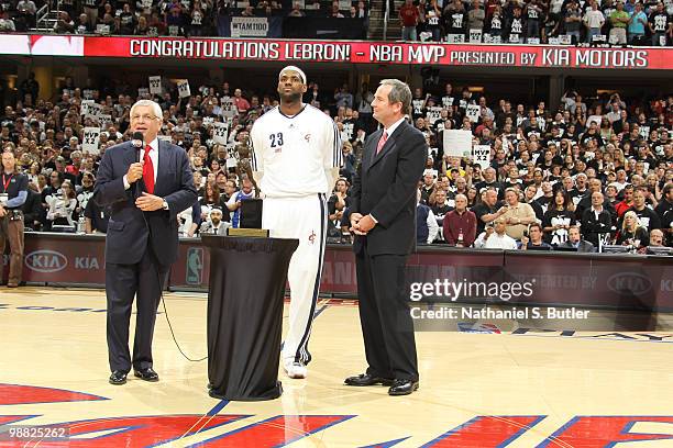 LeBron James of the Cleveland Cavaliers receives the Maurice Podoloff Trophy in recognition for being named the 2009-10 NBA Most Valuable Player...