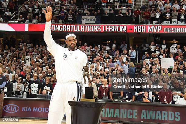 LeBron James of the Cleveland Cavaliers receives the Maurice Podoloff Trophy in recognition for being named the 2009-10 NBA Most Valuable Player...
