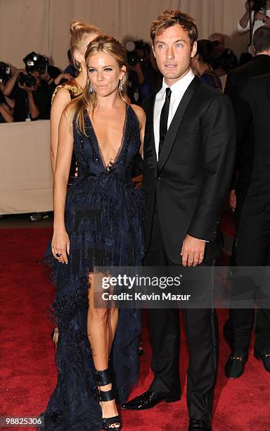 Sienna Miller and Jude Law attends the Costume Institute Gala Benefit to celebrate the opening of the "American Woman: Fashioning a National...