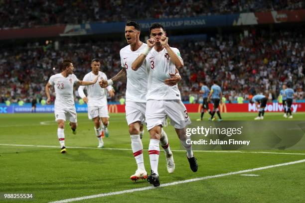 Pepe of Portugal celebrates after scoring his team's first goal with team mate Jose Fonte during the 2018 FIFA World Cup Russia Round of 16 match...