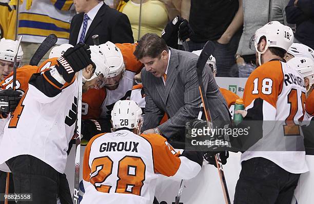 Head coach Peter Laviolette of the Philadelphia Flyers directs his players during a time out in the third period against the Boston Bruins in Game...