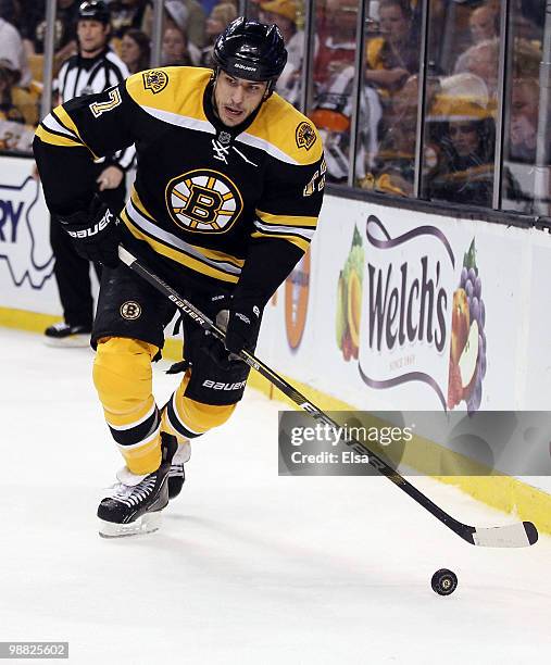 Milan Lucic of the Boston Bruins takes the puck in the third period against the Philadelphia Flyers in Game Two of the Eastern Conference Semifinals...