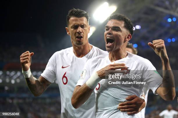 Pepe of Portugal celebrates after scoring his team's first goal with teammate Jose Fonte during the 2018 FIFA World Cup Russia Round of 16 match...