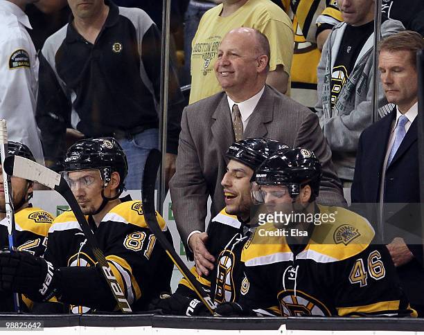Head coach Claude Julien of the Boston Bruins congratulates Milan Lucic after he scored the game winner in the third period against the Philadelphia...