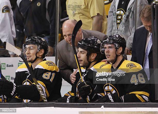 Head coach Claude Julien of the Boston Bruins congratulates Milan Lucic after he scored the game winner in the third period against the Philadelphia...