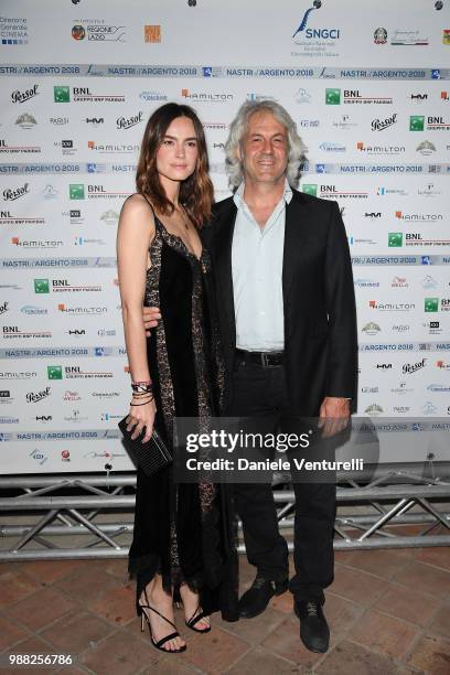 Kasia Smutniak and Domenico Procacci attend the Nastri D'Argento cocktail party on June 30, 2018 in Taormina, Italy.