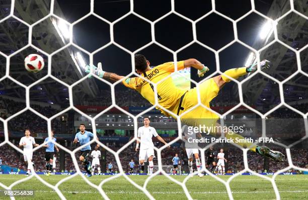 Edinson Cavani of Uruguay scores his team's second goal past Rui Patricio of Portugal during the 2018 FIFA World Cup Russia Round of 16 match between...