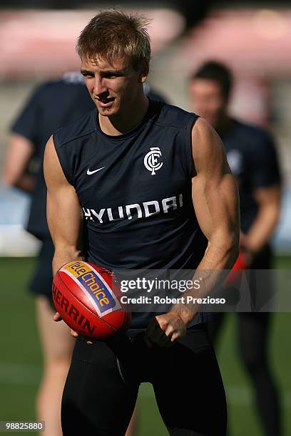 Dennis Armfield handballs during a Carlton Blues AFL training session at Visy Park on May 4, 2010 in Melbourne, Australia.