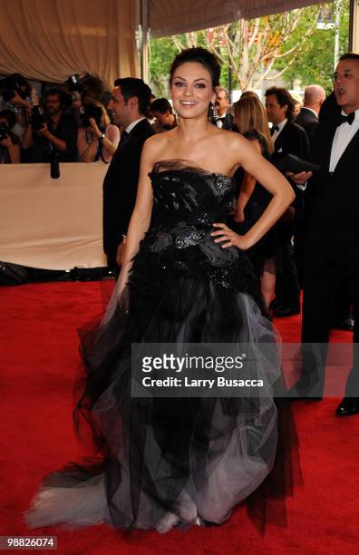 Actress Mila Kunis attends the Costume Institute Gala Benefit to celebrate the opening of the "American Woman: Fashioning a National Identity"...