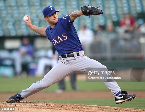 Rich Harden of the Texas Rangers pitches against the Oakland Athletics during an MLB game at the Oakland-Alameda County Coliseum on May 3, 2010 in...