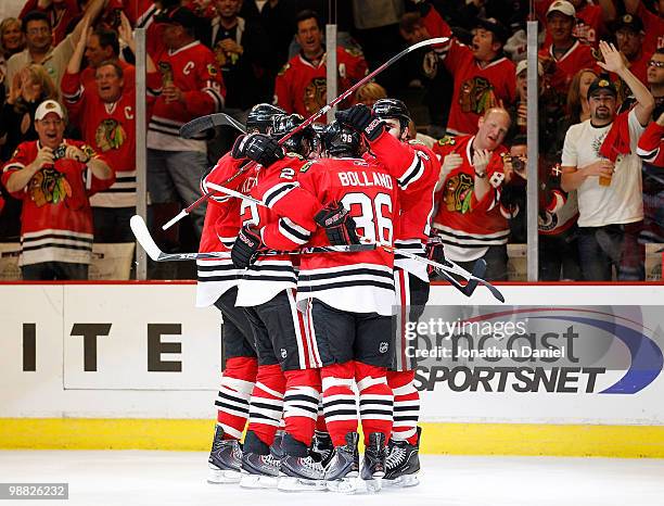 Members of the Chicago Blackhawks including Duncan Keith, Dave Bolland and Andrew Ladd celebrate a goal against the Vancouver Canucks in Game Two of...