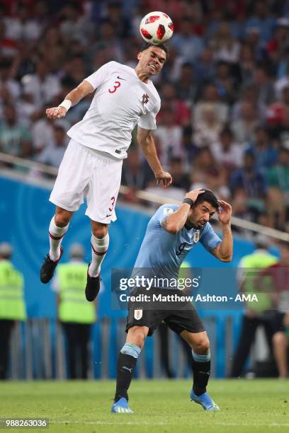 Pepe of Portugal competes with Luis Suarez of Uruguay during the 2018 FIFA World Cup Russia Round of 16 match between Uruguay and Portugal at Fisht...
