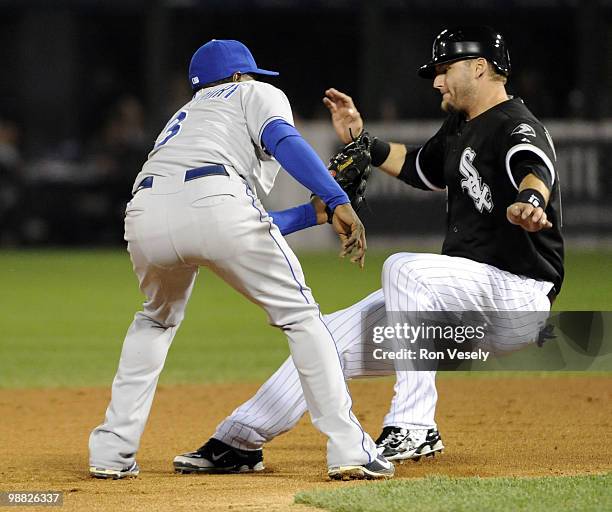 Pierzynski of the Chicago White Sox is tagged out attempting to steal second base by Yuniesky Betancourt of the Kansas City Royals on May 03, 2010 at...