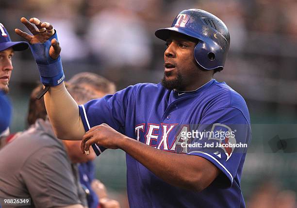 Vladimir Guerrero of the Texas Rangers scores on a sacrafice hit by Ryan Garko in the fourth inning against the Oakland Athletics during an MLB game...