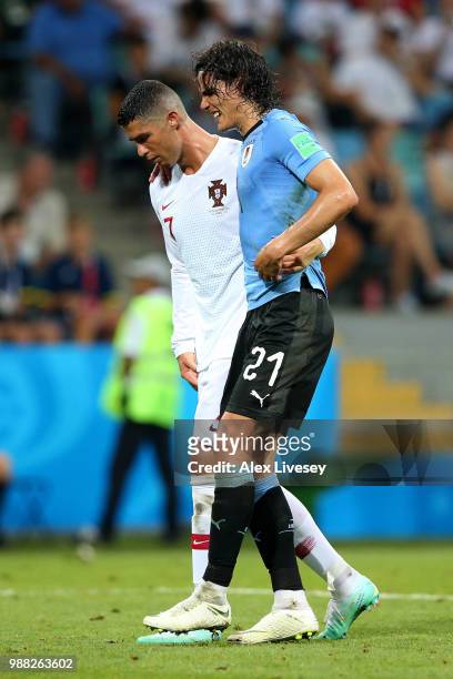 Cristiano Ronaldo of Portugal helps Edinson Cavani of Uruguay off the pitch after he gets injured during the 2018 FIFA World Cup Russia Round of 16...