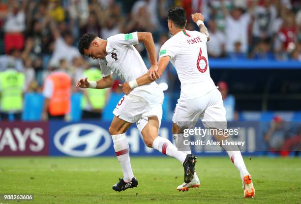 Pepe of Portugal celebrates after scoring his team's first goal with team mate Jose Fonte during the 2018 FIFA World Cup Russia Round of 16 match...