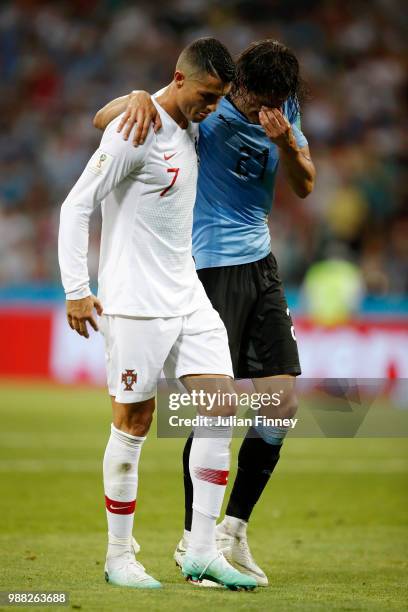 Cristiano Ronaldo of Portugal helps Edinson Cavani of Uruguay off the pitch after he gets injured during the 2018 FIFA World Cup Russia Round of 16...