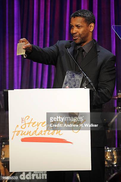 Actor Denzel Washington accepts award during the New York Gala benefiting The Steve Harvey Foundation at Cipriani, Wall Street on May 3, 2010 in New...