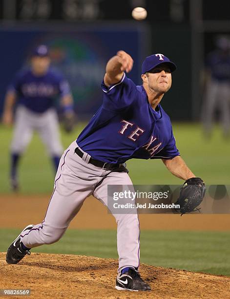 Rich Harden of the Texas Rangers pitches against the Oakland Athletics during an MLB game at the Oakland-Alameda County Coliseum on May 3, 2010 in...