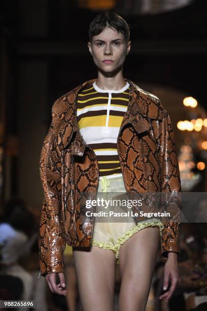 Model walks the runway during Miu Miu 2019 Cruise Collection Show at Hotel Regina on June 30, 2018 in Paris, France.