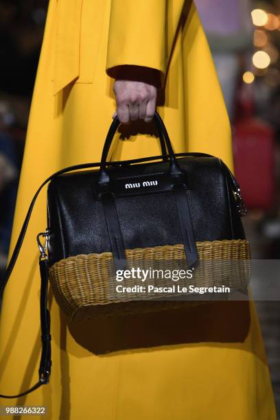 Model,bag detail, walks the runway during Miu Miu 2019 Cruise Collection Show at Hotel Regina on June 30, 2018 in Paris, France.