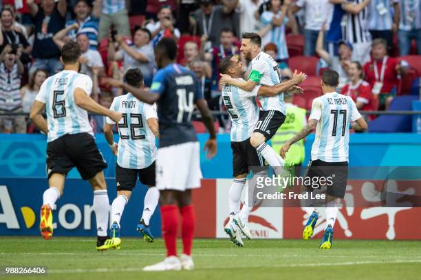 Gabriel Mercado of Argentina celebrates after scoring his team's second goal with team mates Lionel Messi and Angel Di Maria during the 2018 FIFA...