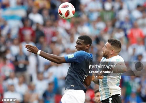 Paul Pogba vies with Nicolas Otamendi during 2018 FIFA World Cup Russia Round of 16 match between France and Argentina at the Kazan Arena in Kazan,...