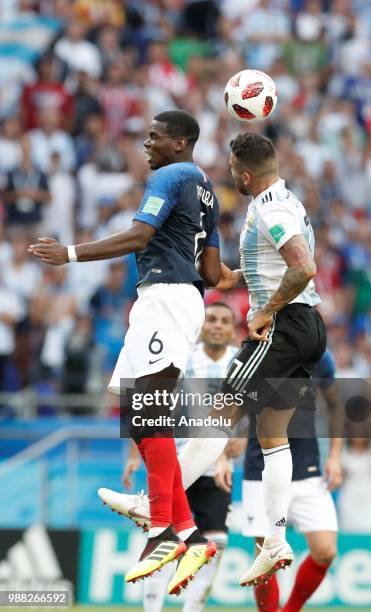 Paul Pogba vies with Nicolas Otamendi during 2018 FIFA World Cup Russia Round of 16 match between France and Argentina at the Kazan Arena in Kazan,...