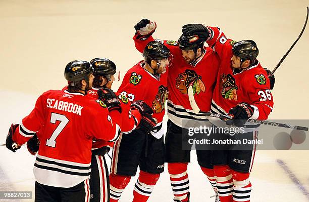 Brent Seabrook, Duncan Keith, Kris Versteeg, Andrew Ladd and Dave Bolland of the Chicago Blackhawks celebrate a 3rd period goal against the Vancouver...