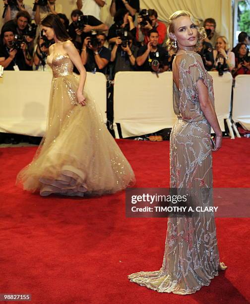 Actress Anne Hathaway and kate Bosworth attend the Costume Institute Gala Benefit to celebrate the opening of the 'American Woman: Fashioning a...