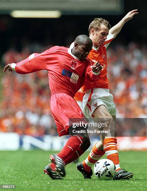 Brett Ormerod of Blackpool holds off the challenge of Matthew Joseph of Orient during the match between Blackpool v Leyton Orient in the Nationwide...