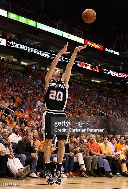 Manu Ginobili of the San Antonio Spurs puts up a three point shot against the Phoenix Suns during Game One of the Western Conference Semifinals of...