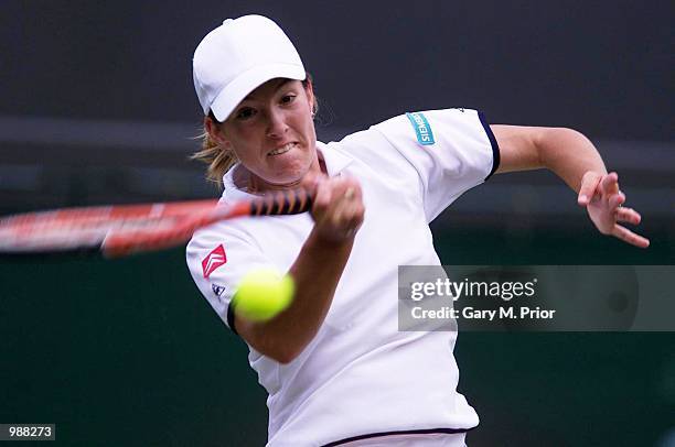 Justine Henin of Belgium on her way to victory over Lisa Raymond of the USA during the women's third round of The All England Lawn Tennis...