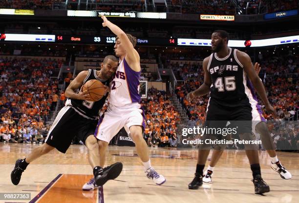 Tony Parker of the San Antonio Spurs drives the ball against Goran Dragic of the Phoenix Suns during Game One of the Western Conference Semifinals of...