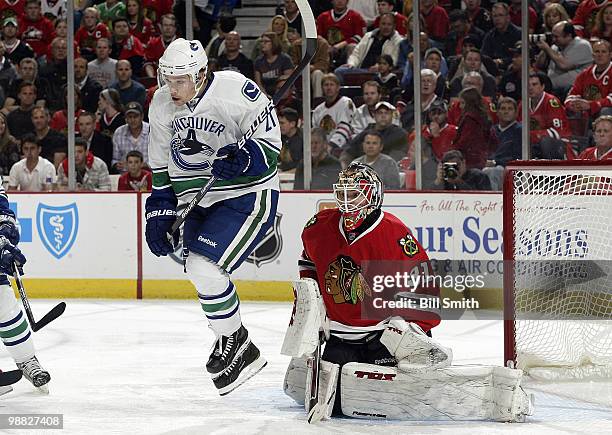 Mason Raymond of the Vancouver Canucks jumps off the ice in front of Chicago Blackhawks goalie Antti Niemi Game Two of the Western Conference...