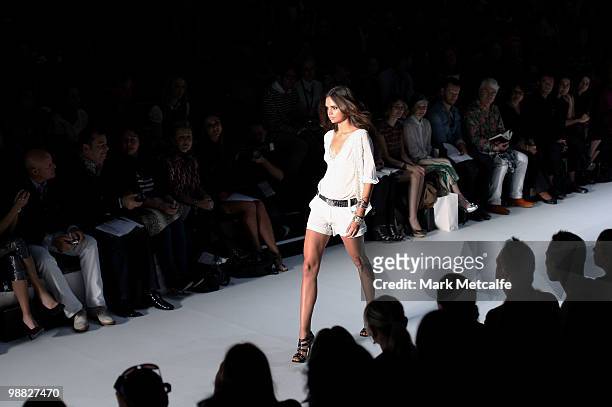 Model Samantha Harris showcases designs on the catwalk at the Little Joe Woman collection show on the second day of Rosemount Australian Fashion Week...