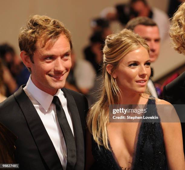 Actors Jude Law and Sienna Miller attend the Costume Institute Gala Benefit to celebrate the opening of the "American Woman: Fashioning a National...