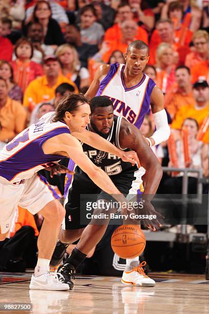 Steve Nash of the Phoenix Suns fights for a loose ball with DeJuan Blair of the San Antonio Spurs in Game One of the Western Conference Semifinals...