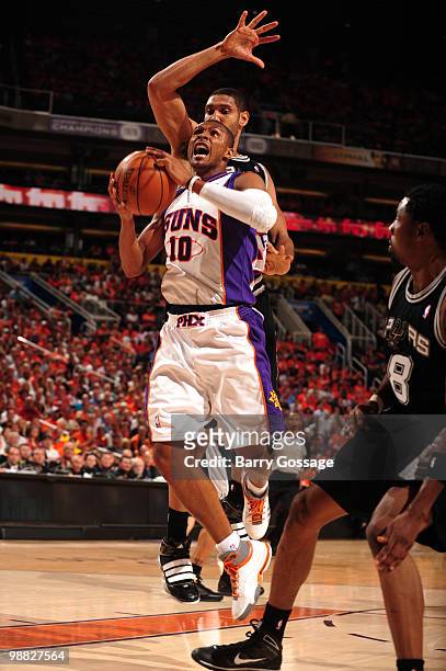Leandro Barbosa of the Phoenix Suns drives for a shot past Tim Duncan of the San Antonio Spurs in Game One of the Western Conference Semifinals...
