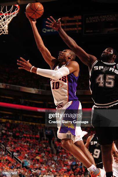 Leandro Barbosa of the Phoenix Suns drives for a shot against DeJuan Blair of the San Antonio Spurs in Game One of the Western Conference Semifinals...