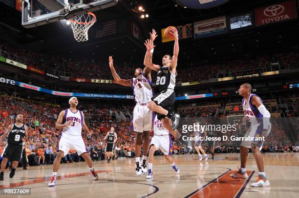Manu Ginobili of the San Antonio Spurs shoots against Channing Frye of the Phoenix Suns in Game One of the Western Conference Semifinals during the...