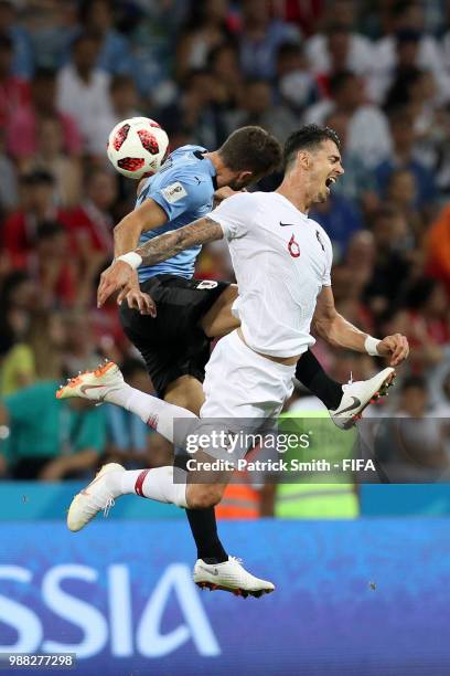 Cristhian Stuani of Uruguay and Jose Fonte of Portugal battle for the header during the 2018 FIFA World Cup Russia Round of 16 match between Uruguay...