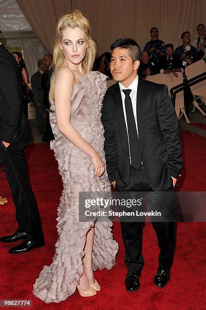 Riley Keough and designer Thakoon Panichgul attend the Costume Institute Gala Benefit to celebrate the opening of the "American Woman: Fashioning a...