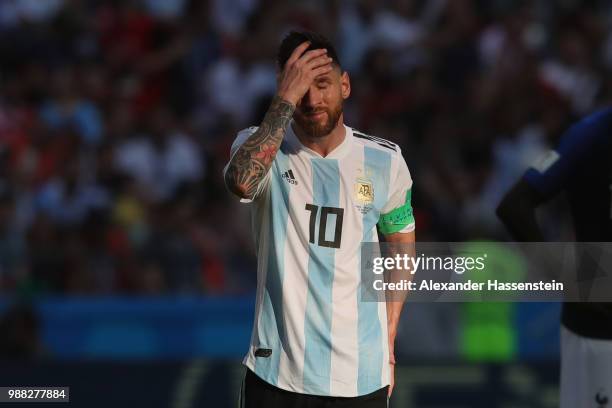 Lionel Messi of Argentina looks dejected during the 2018 FIFA World Cup Russia Round of 16 match between France and Argentina at Kazan Arena on June...