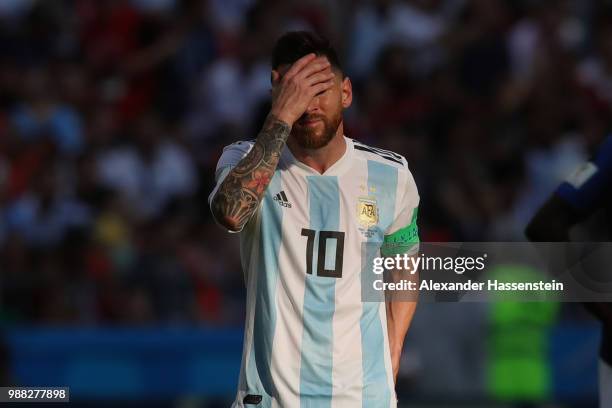 Lionel Messi of Argentina looks dejected during the 2018 FIFA World Cup Russia Round of 16 match between France and Argentina at Kazan Arena on June...