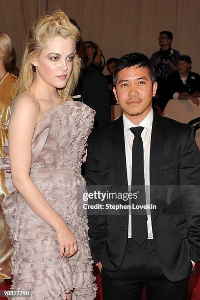 Riley Keough and designer Thakoon Panichgul attend the Costume Institute Gala Benefit to celebrate the opening of the "American Woman: Fashioning a...