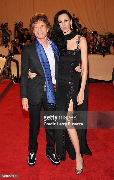 Musician Mick Jagger and designer L'Wren Scott attend the Costume Institute Gala Benefit to celebrate the opening of the "American Woman: Fashioning...