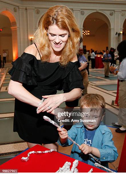 Alex McCord makes bracelets with her son Johan van Kempen at the launch party of Rick Riordan's The Kane Chronicles, Book 1: The Red Pyramid at...