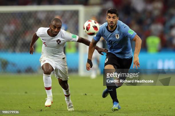 Ricardo of Portugal and Luis Suarez of Uruguay battle for the ball during the 2018 FIFA World Cup Russia Round of 16 match between Uruguay and...